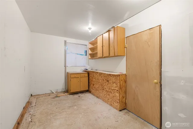 a view of a kitchen with wooden floor