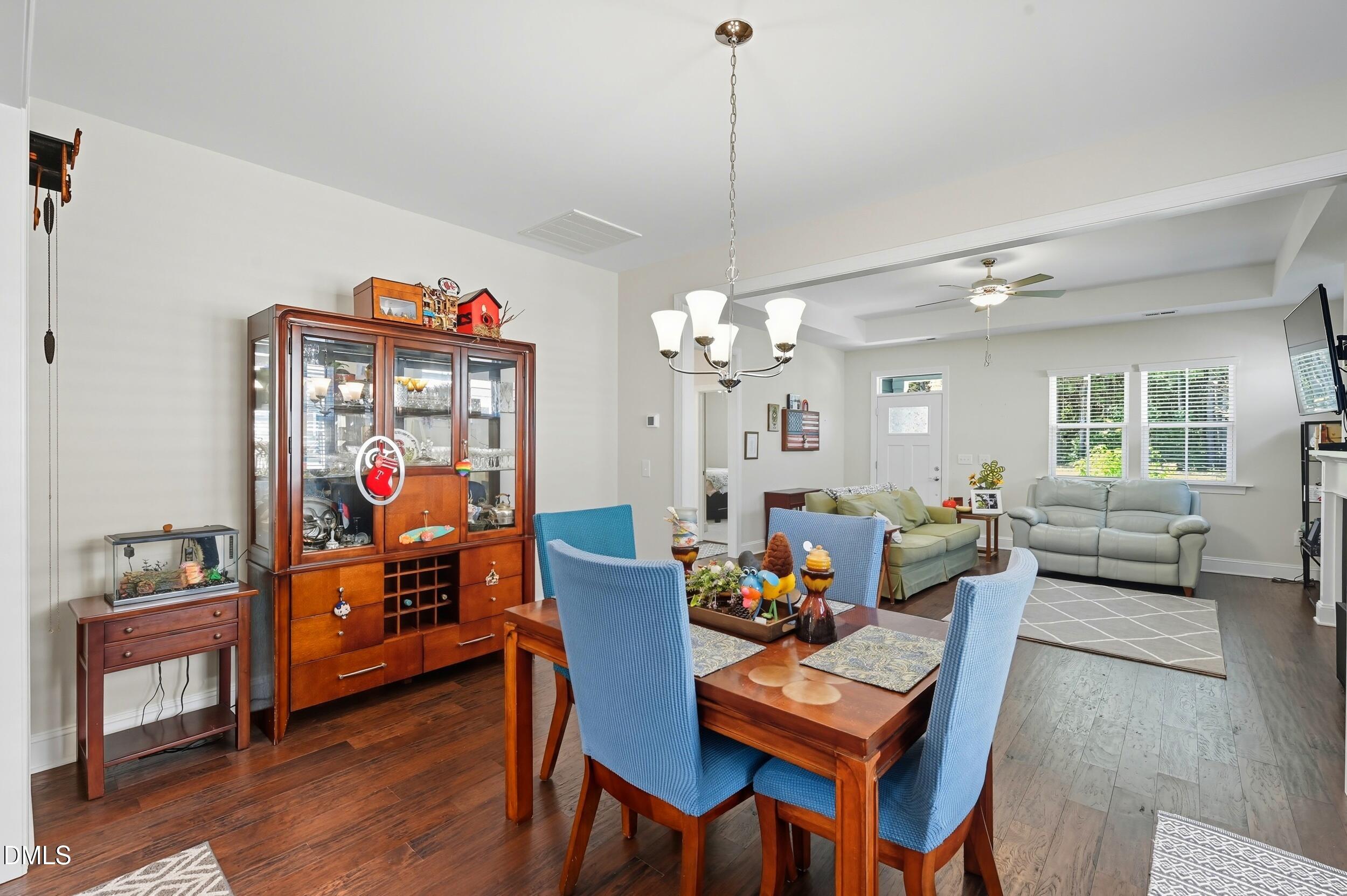 116 Beaufort Loop Clayton, NC 27520 - Photo 14 of 33 a view of a dining room with furniture and wooden floor