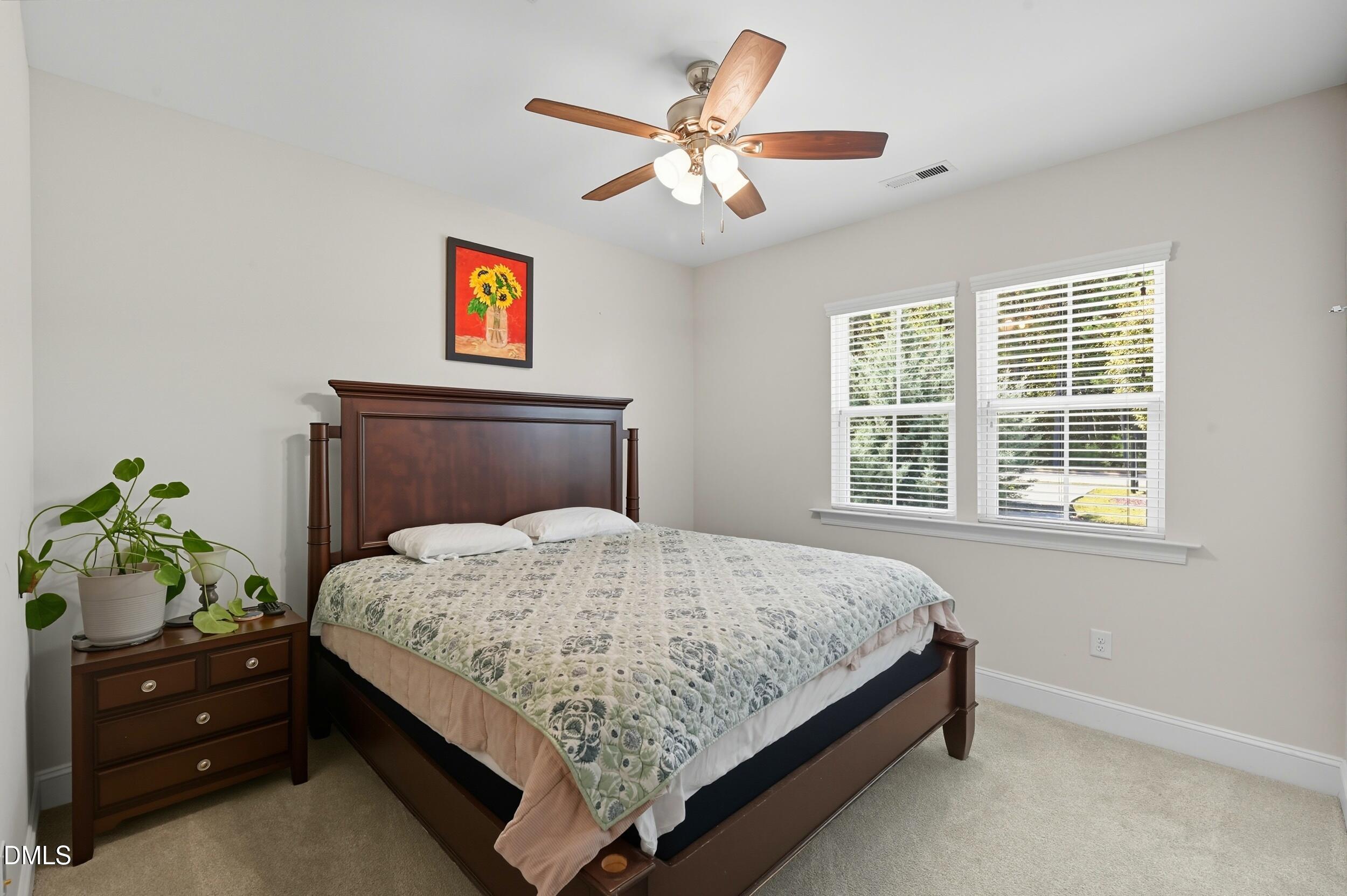 116 Beaufort Loop Clayton, NC 27520 - Photo 19 of 33 a bedroom with a bed and window