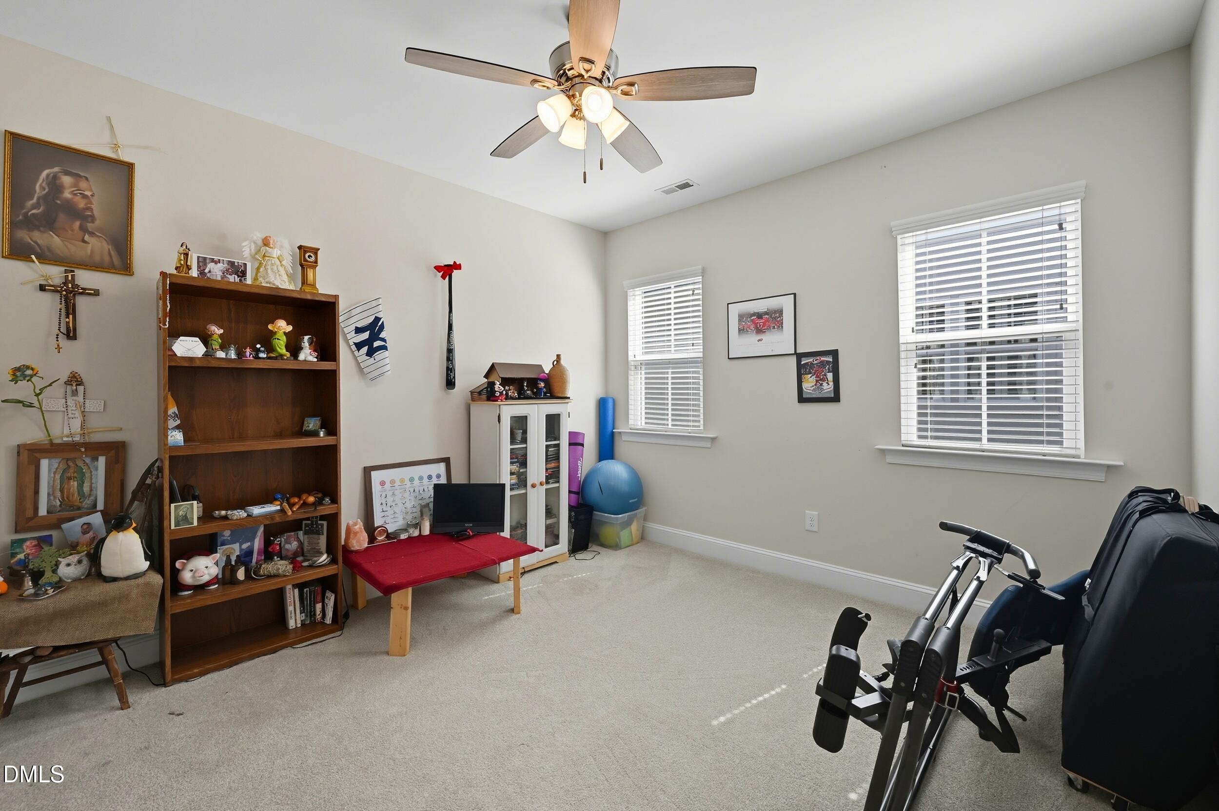 116 Beaufort Loop Clayton, NC 27520 - Photo 22 of 33 a room with furniture and a window