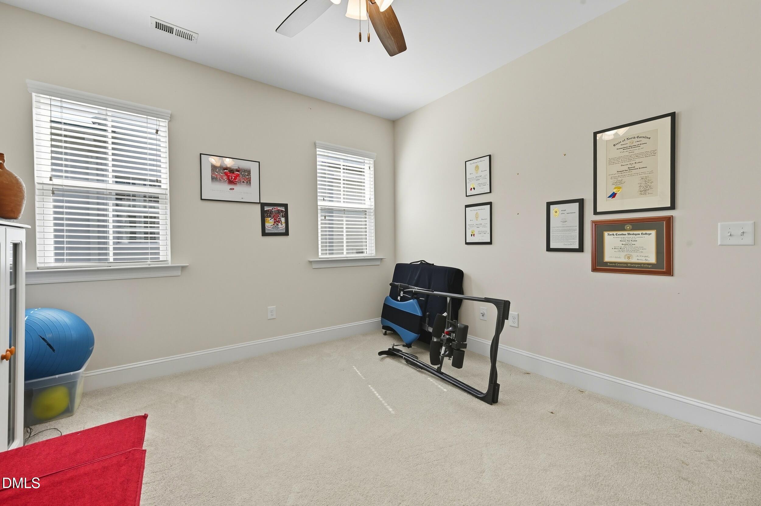 116 Beaufort Loop Clayton, NC 27520 - Photo 23 of 33 a livingroom with workspace and a window