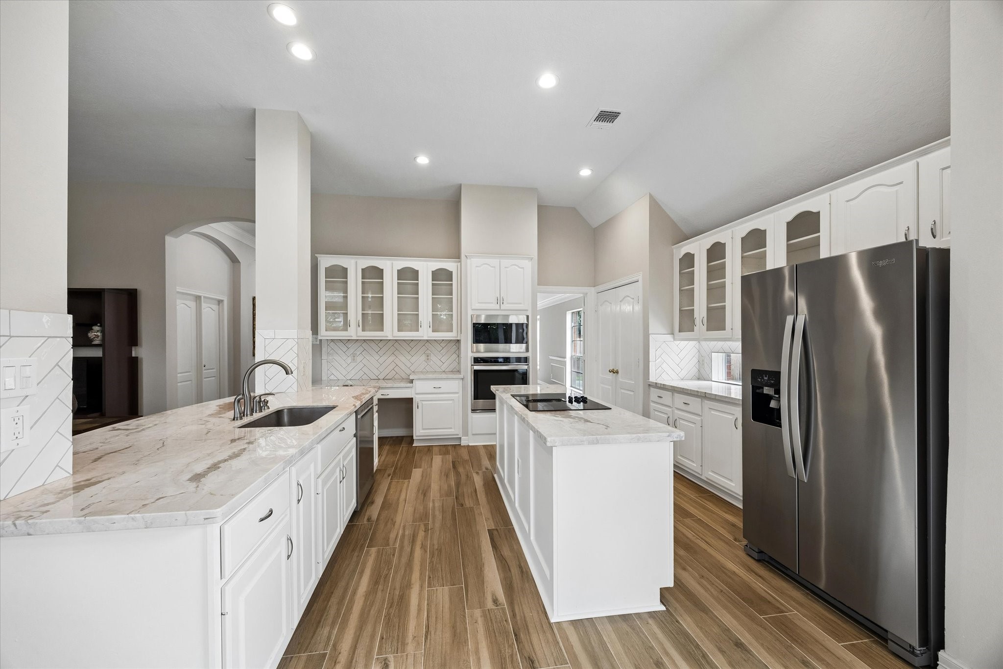5306 Summerland Ridge Court Houston, TX 77041 - Photo 13 of 33 a kitchen with stainless steel appliances a refrigerator sink and stove