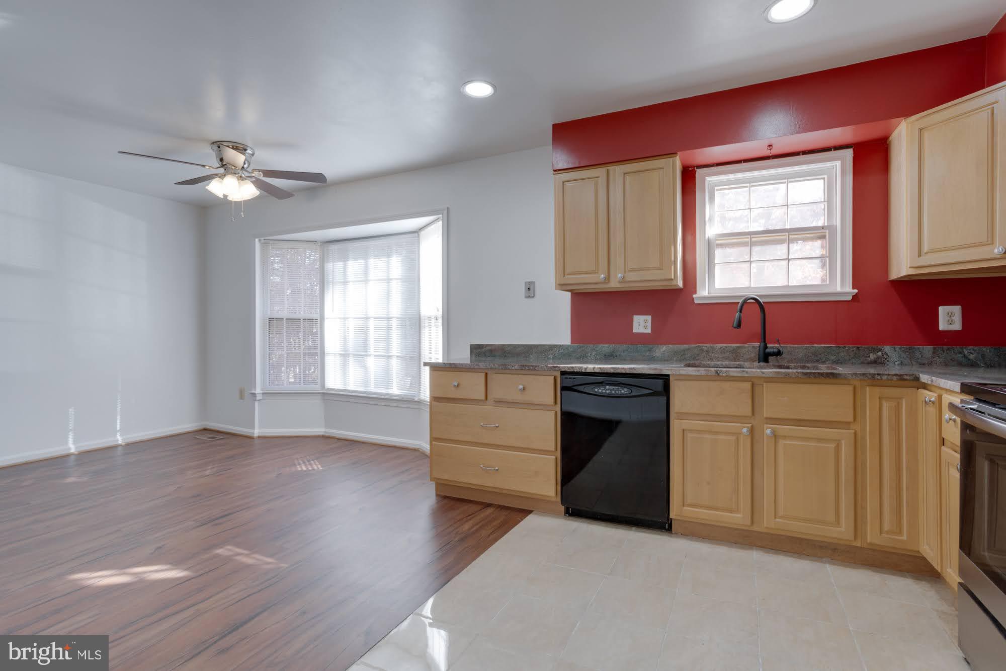 9043 Blarney Stone Drive Springfield, VA 22152 - Photo 9 of 23 a kitchen with stainless steel appliances granite countertop a stove a sink and a refrigerator