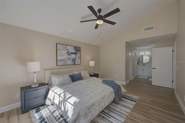 a view of an empty room and wooden floor
