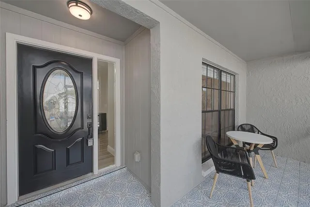 a view of a livingroom with furniture and a mirror