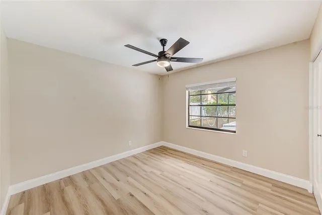 a swimming pool with outdoor seating and yard