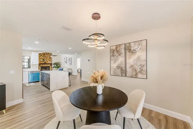 a dining room with furniture and window
