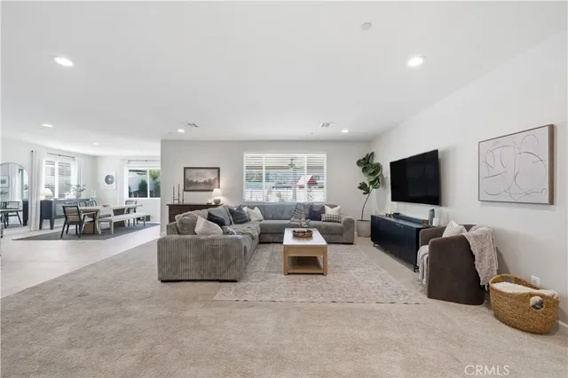a living room with furniture and a table