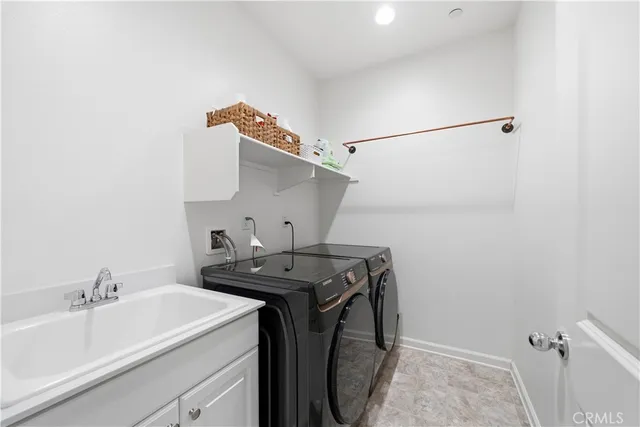 a kitchen with a refrigerator and cabinets