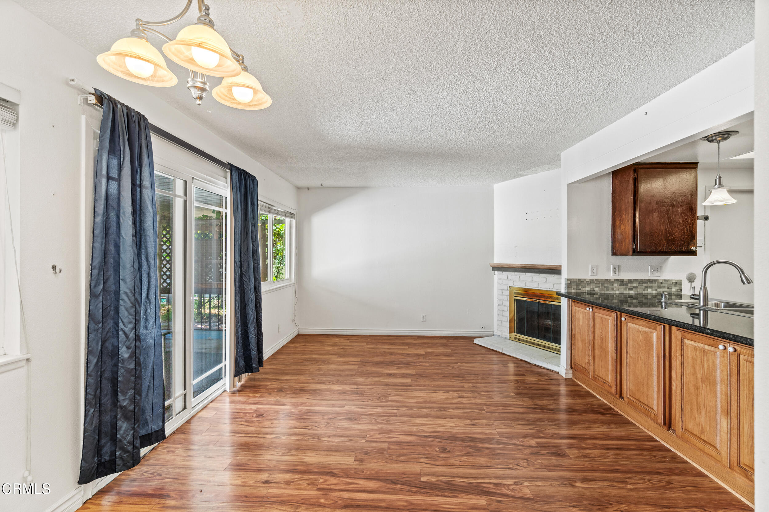 3330 Ketch Avenue Oxnard, CA 93035 - Photo 12 of 45 a view of a kitchen with stainless steel appliances granite countertop a refrigerator and a sink