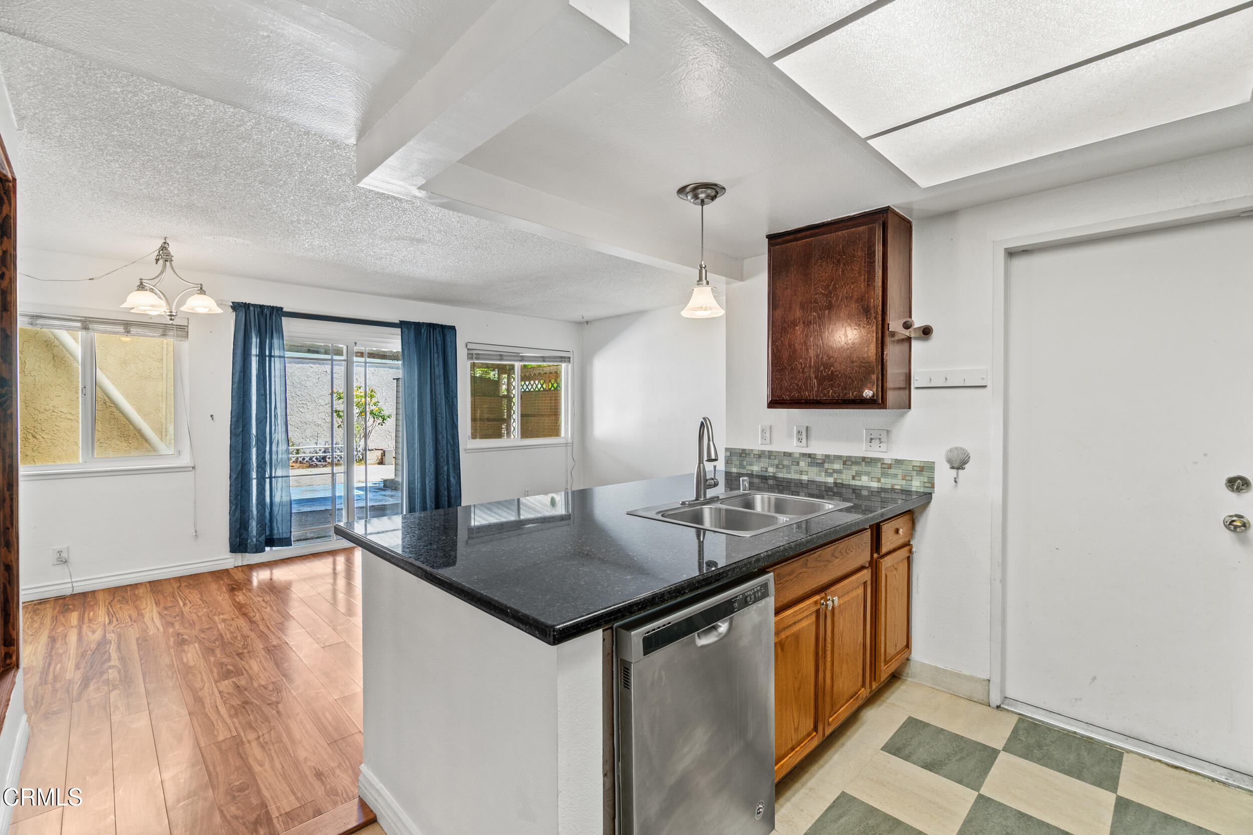 3330 Ketch Avenue Oxnard, CA 93035 - Photo 18 of 45 a kitchen with stainless steel appliances granite countertop a sink stove and refrigerator