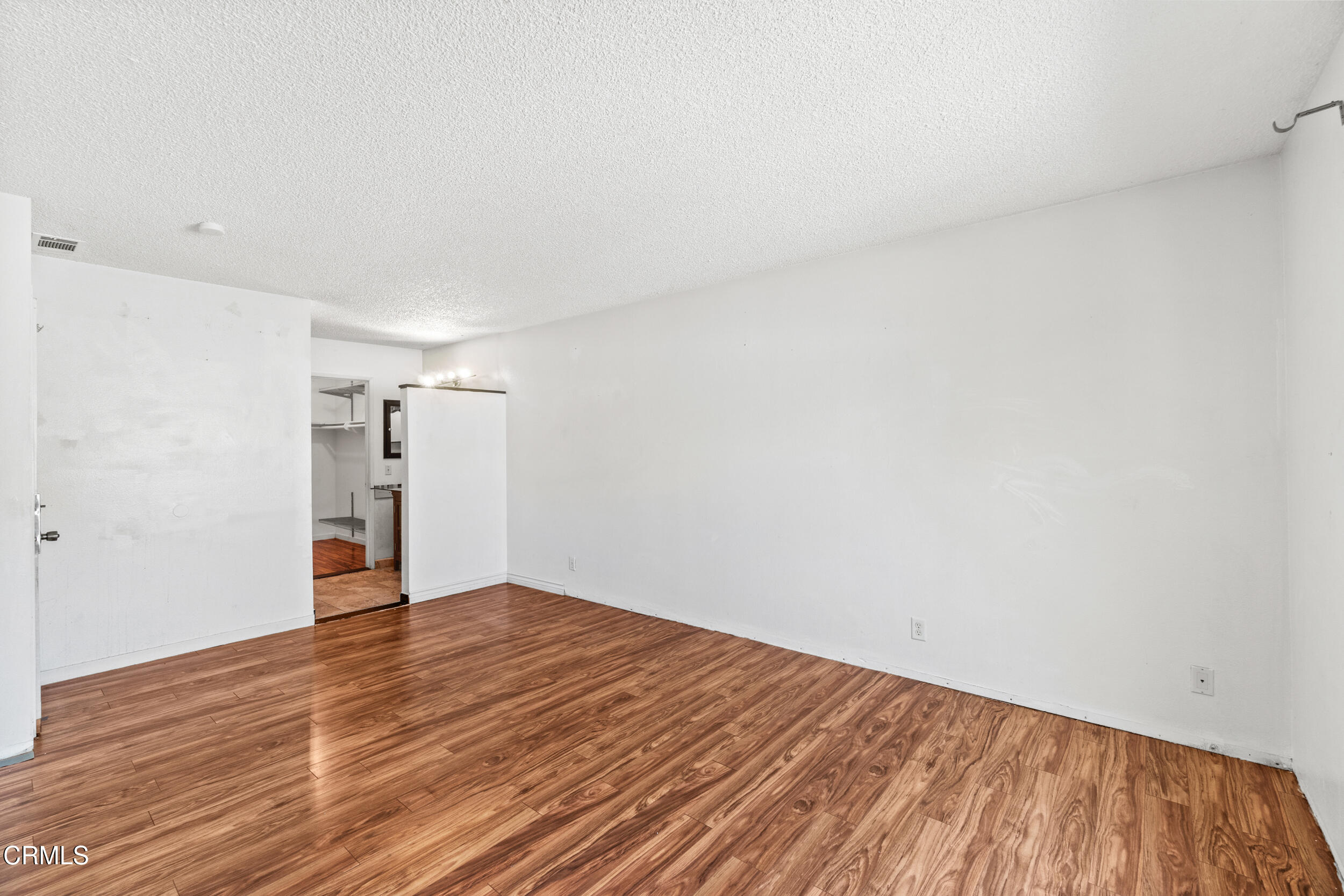3330 Ketch Avenue Oxnard, CA 93035 - Photo 22 of 45 a view of empty room with wooden floor