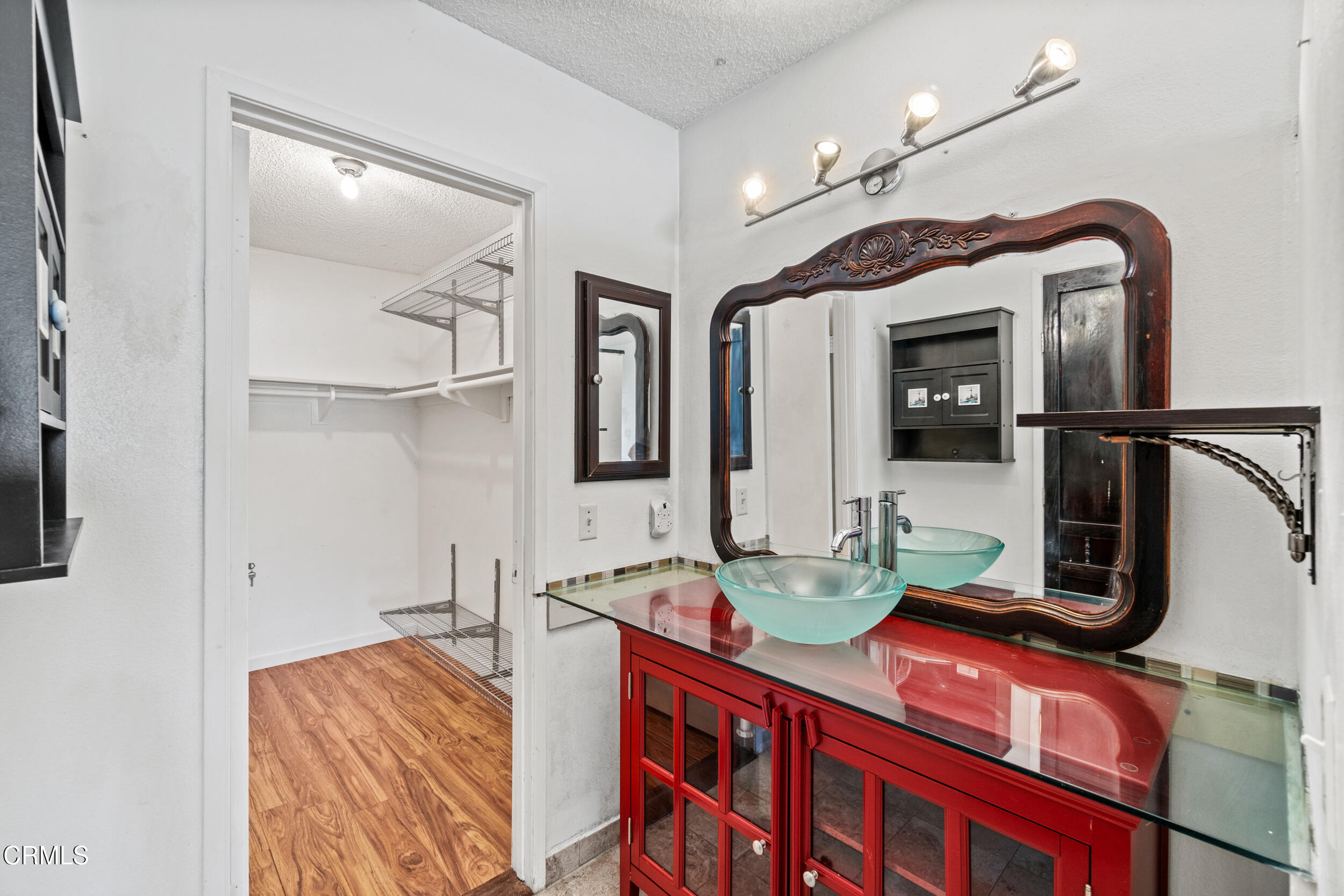 3330 Ketch Avenue Oxnard, CA 93035 - Photo 23 of 45 a bathroom with double vanity and a mirror