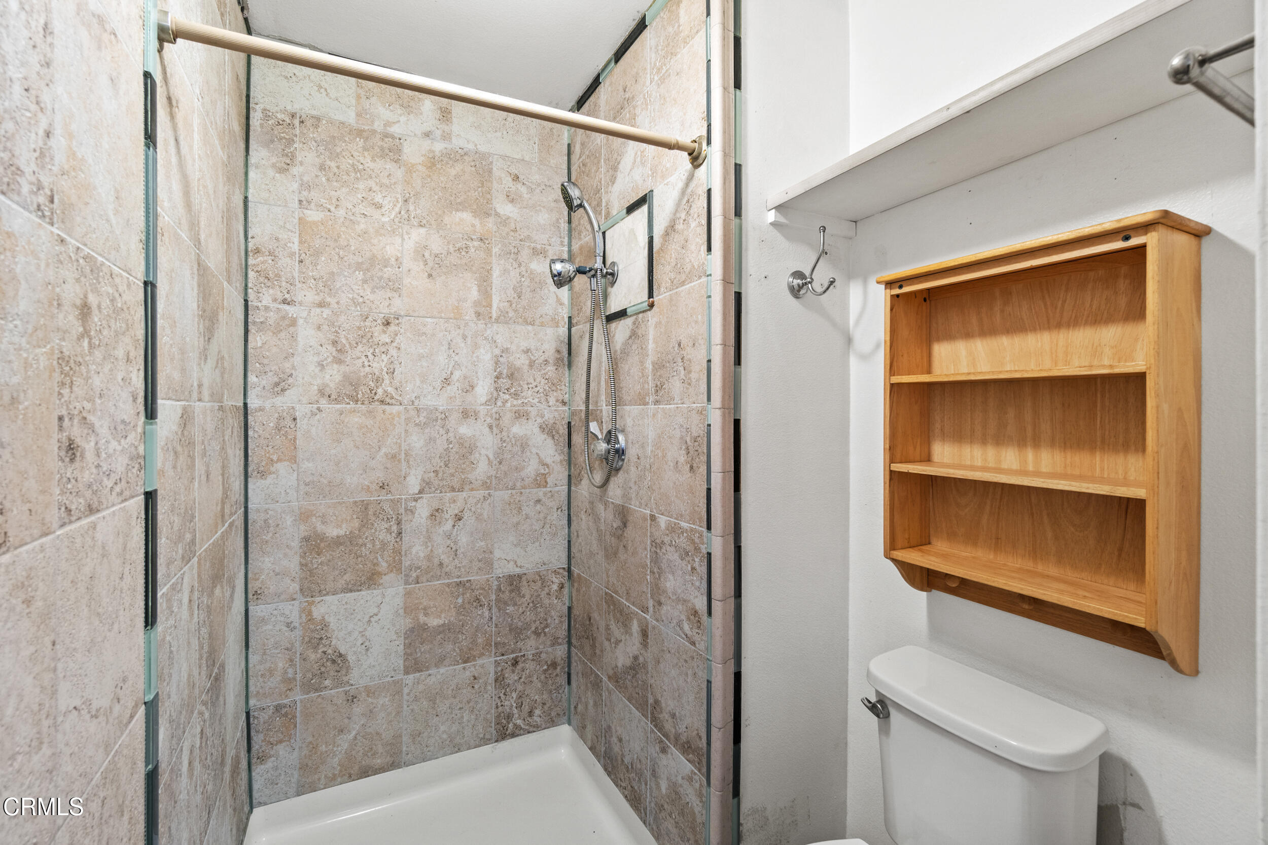 3330 Ketch Avenue Oxnard, CA 93035 - Photo 25 of 45 a bathroom with a shower and a toilet