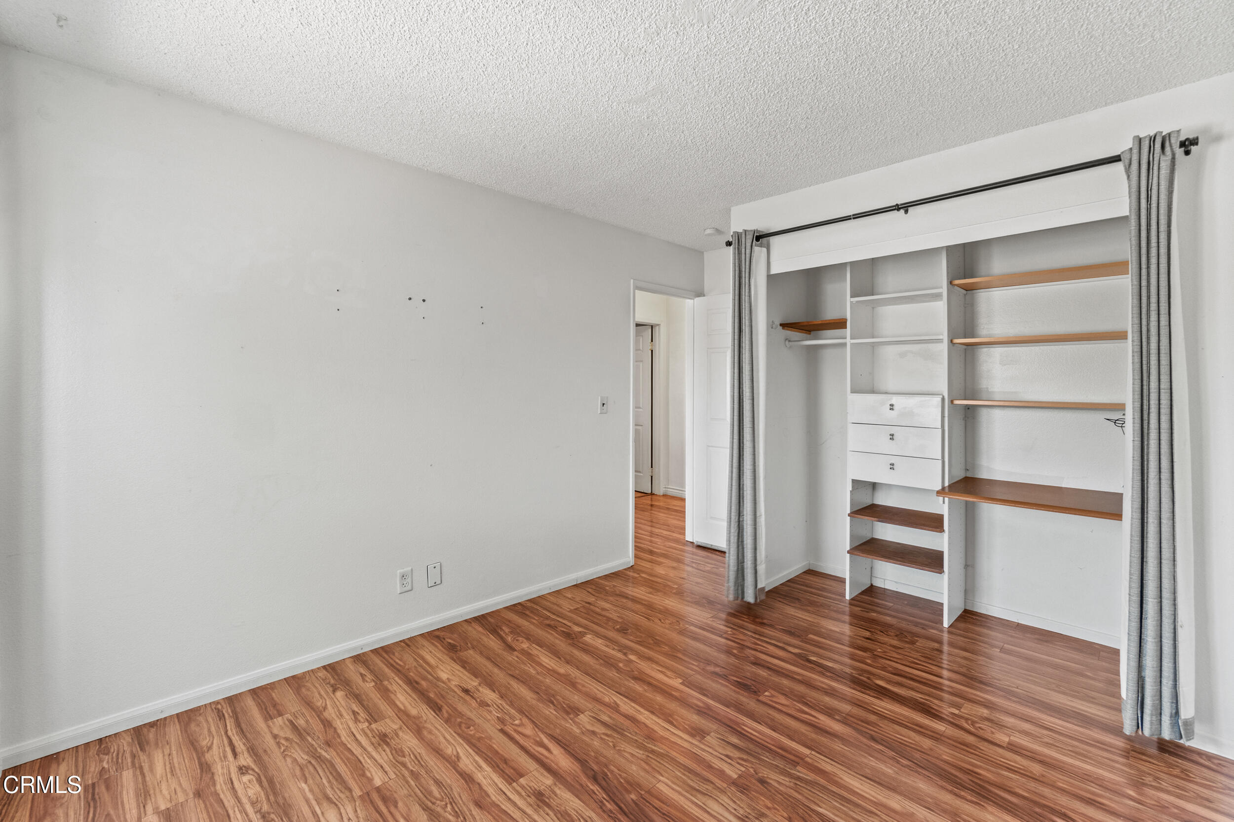 3330 Ketch Avenue Oxnard, CA 93035 - Photo 27 of 45 a view of empty room with wooden floor and window