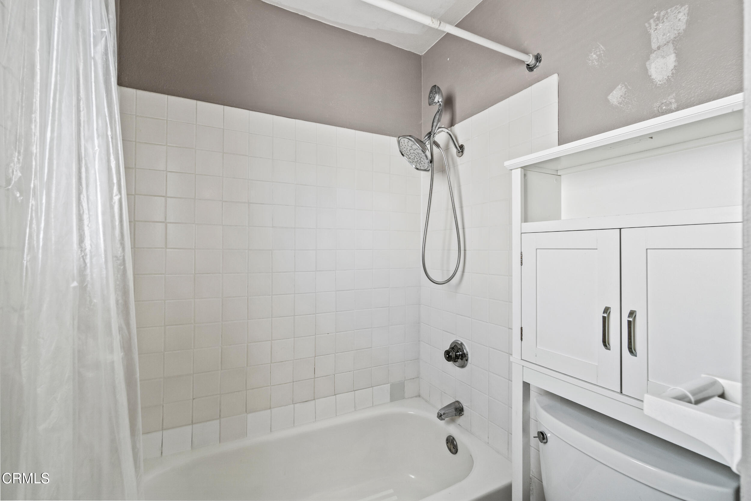 3330 Ketch Avenue Oxnard, CA 93035 - Photo 33 of 45 a bathroom with a bath tub with a shower