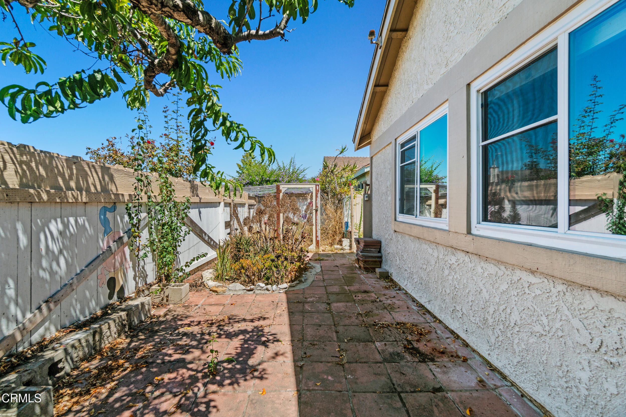 3330 Ketch Avenue Oxnard, CA 93035 - Photo 39 of 45 a view of a pathway with a yard