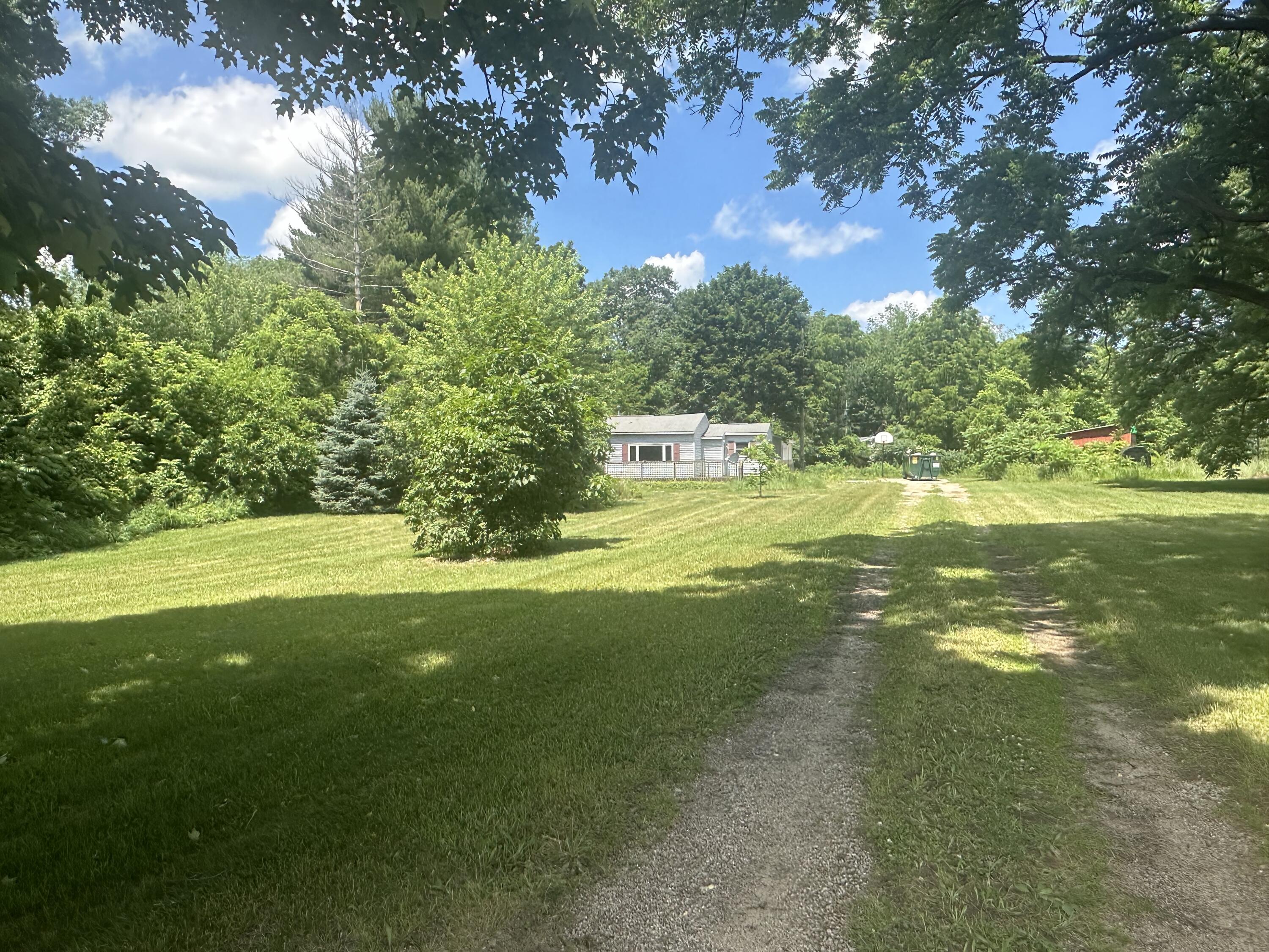 14980 Hall Road Ravenna, MI 49451 - Photo 1 of 22 Long Driveway to home