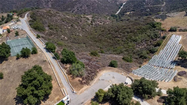 an aerial view of house with yard