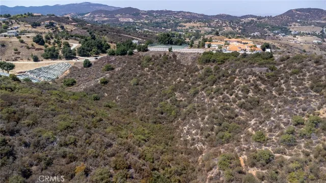 an aerial view of residential house and green space