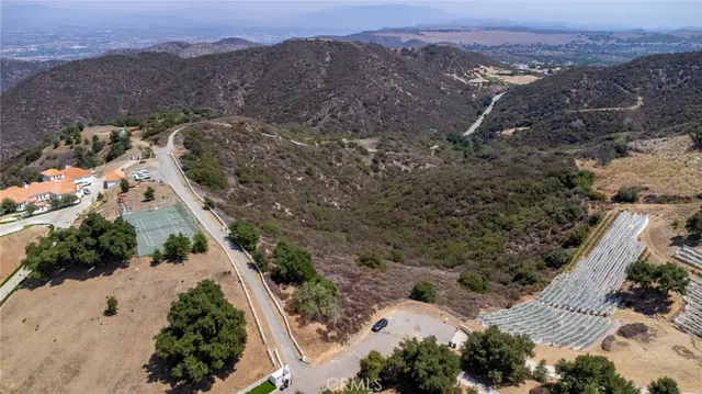 an aerial view of residential house and green space