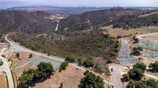 an aerial view of house with mountain view