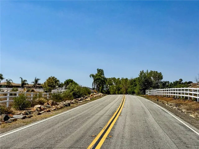 a view of a balcony with two chairs