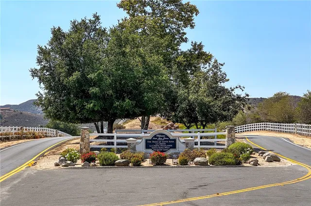 a view of a swimming pool with a patio and a garden