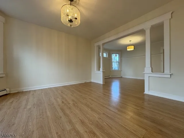 a view of a livingroom with wooden floor