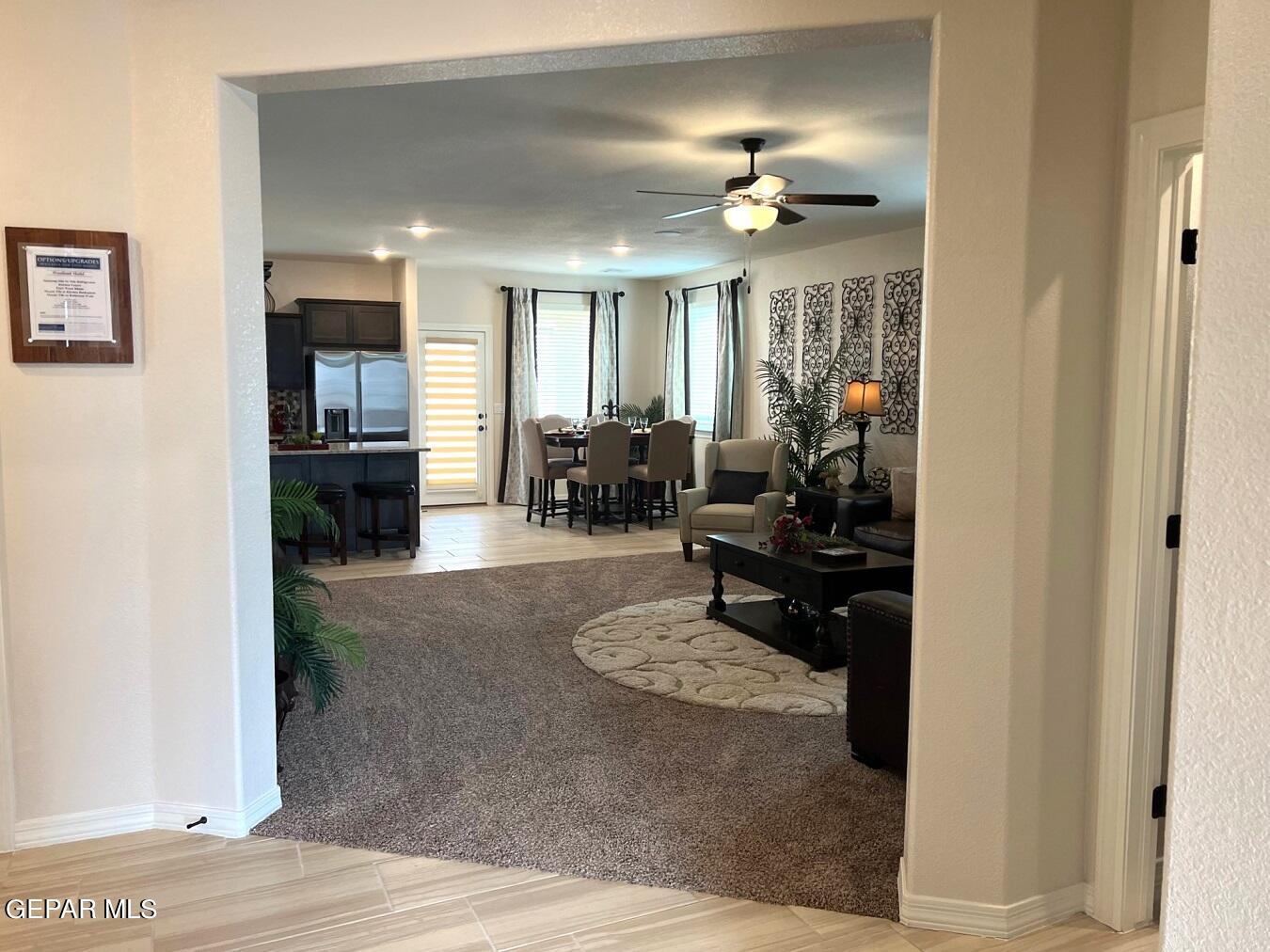 12869 Crystal Downs El Paso, TX 79928 - Photo 2 of 18 a living room with furniture and a chandelier