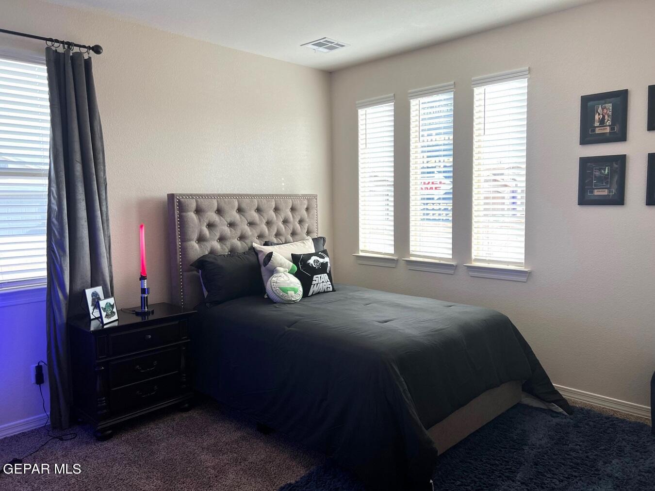 12869 Crystal Downs El Paso, TX 79928 - Photo 8 of 18 a bed sitting in a bedroom next to a window