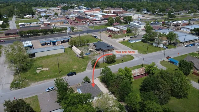 an aerial view of residential houses with outdoor space