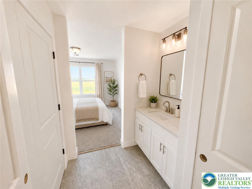 3104 Moyer Road Hellertown, PA 18055 - Photo 12 of 24 An integrated vanity area links seamlessly to the sleeping quarters beyond.