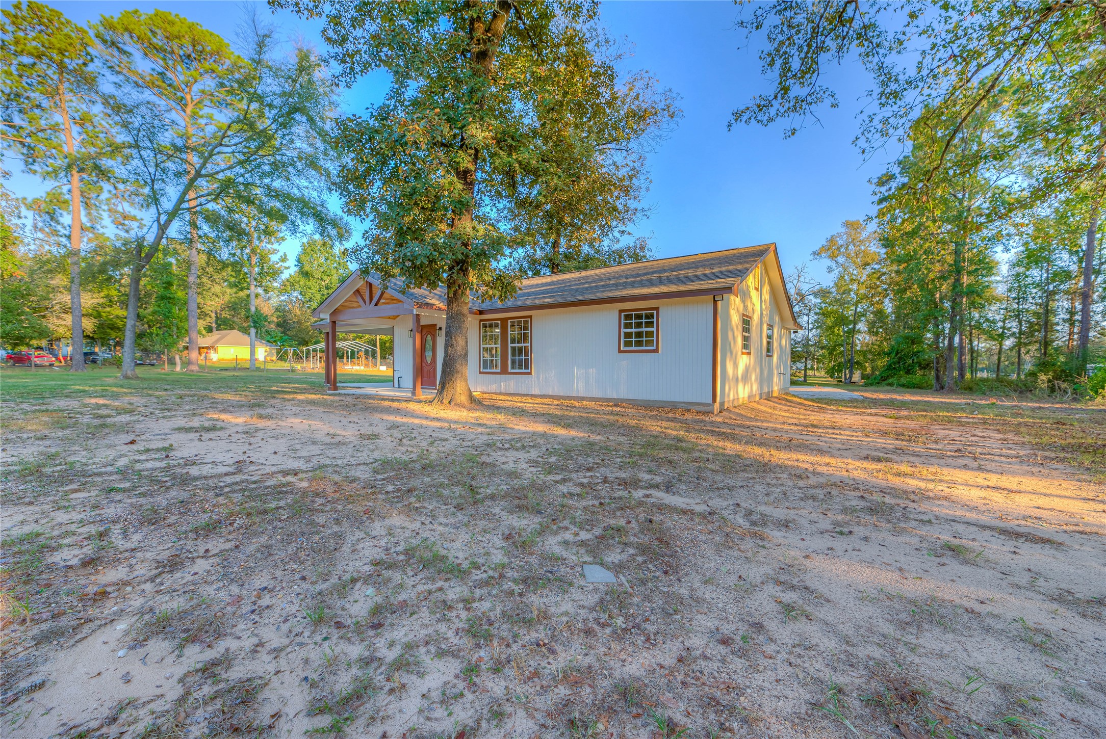 388 Sunrise Wood Road Goodrich, TX 77335 - Photo 21 of 33 a view of a house with a yard and large tree