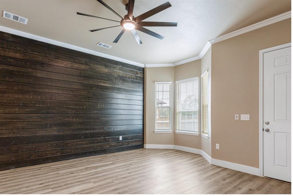 413 Henderson Street Bonham, TX 75418 - Photo 4 of 27 wooden floor in an empty room