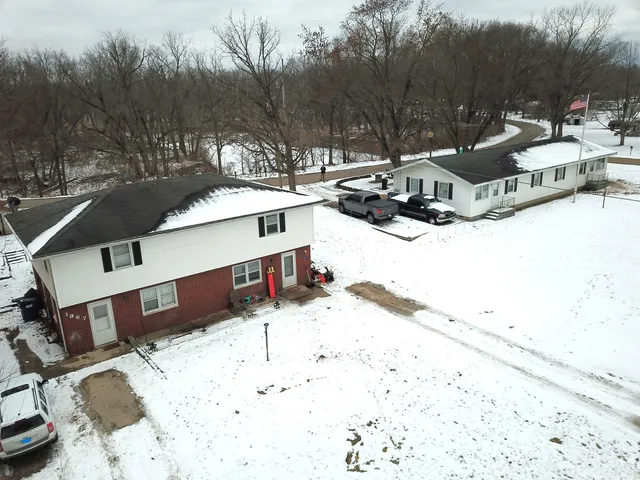 a view of a covered with snow on the road