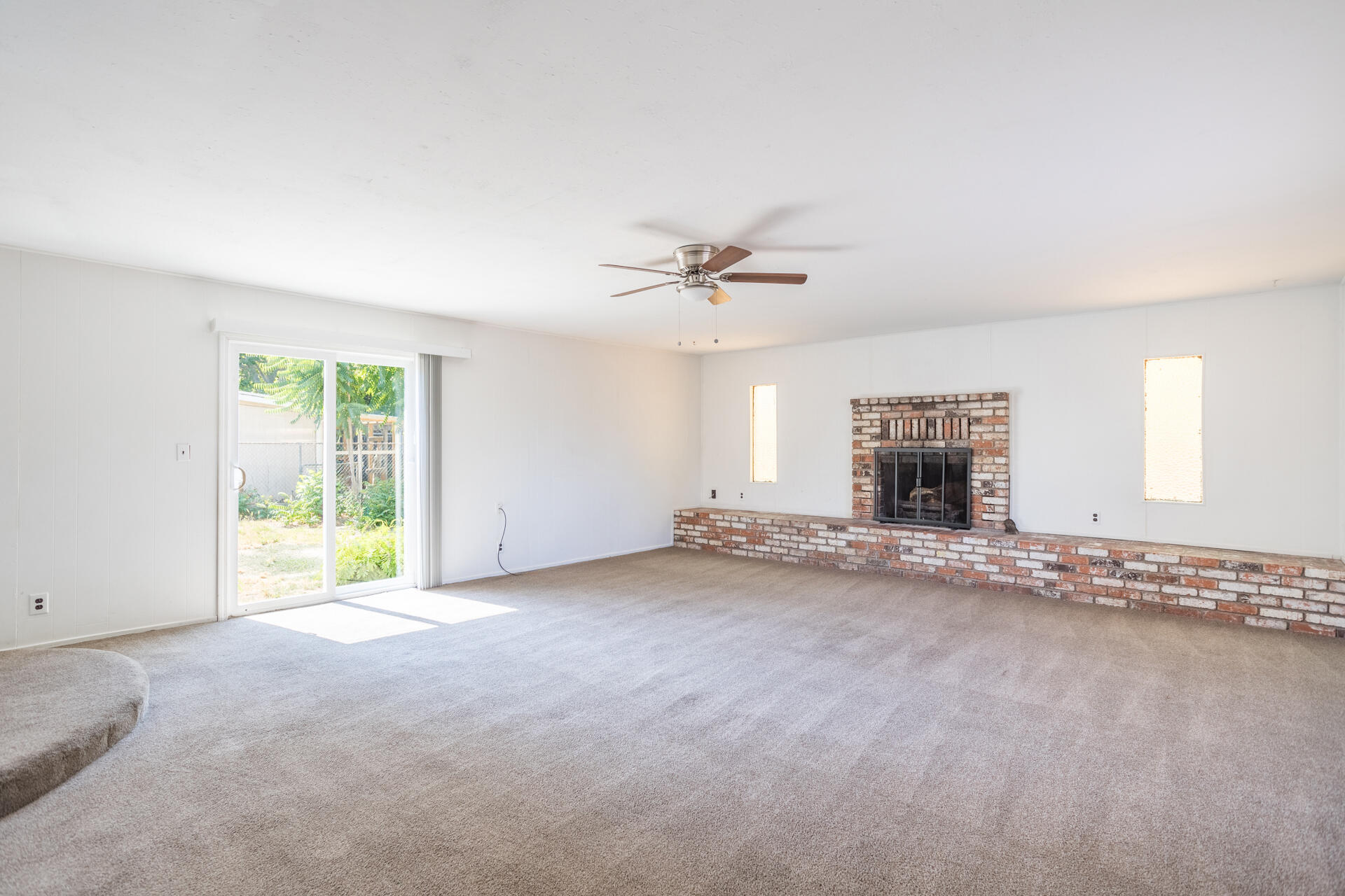 1105 5th Street Redding, CA 96002 - Photo 4 of 11 a view of a livingroom with a fireplace and a window