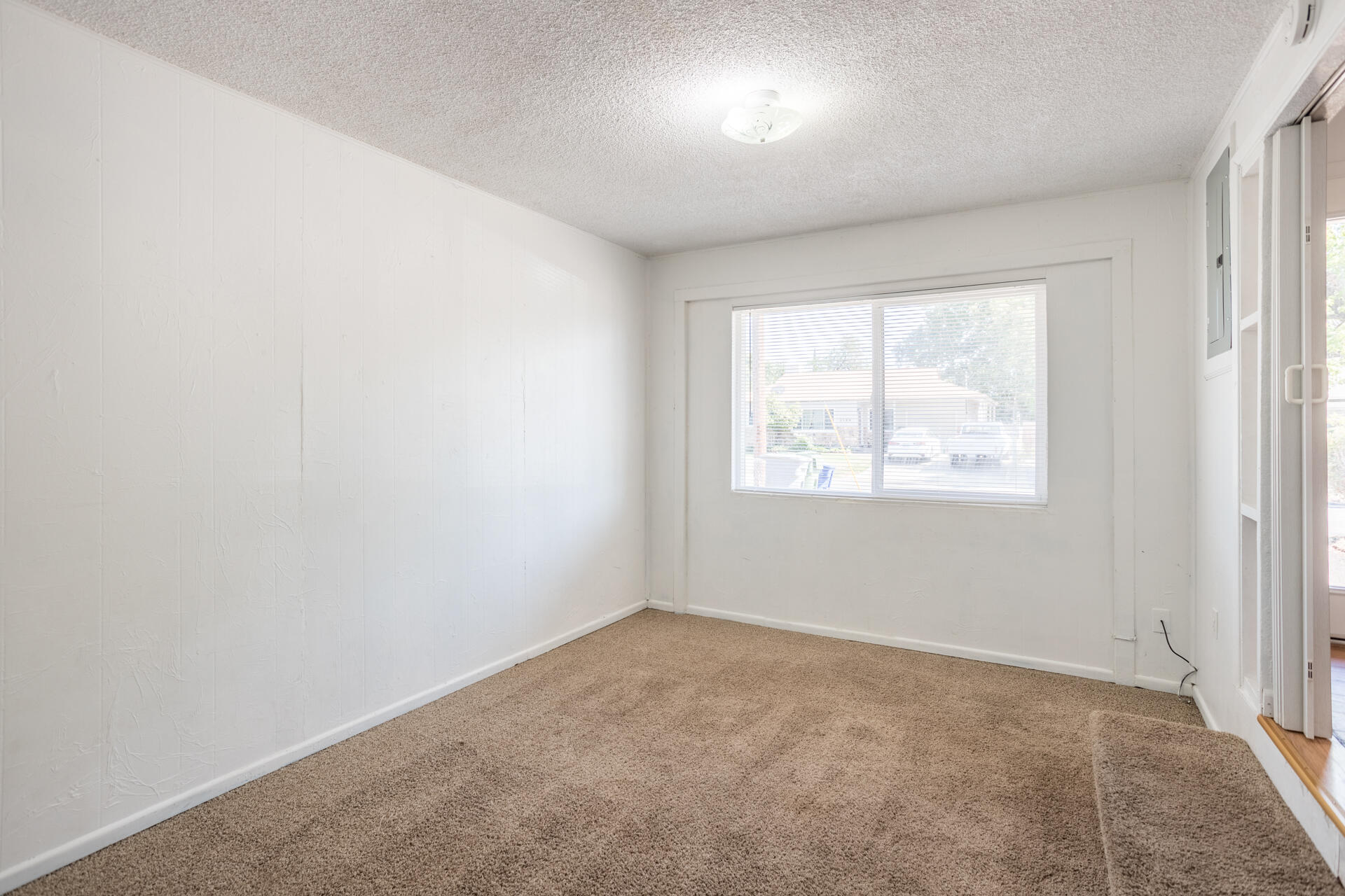 1105 5th Street Redding, CA 96002 - Photo 9 of 11 an empty room with a window