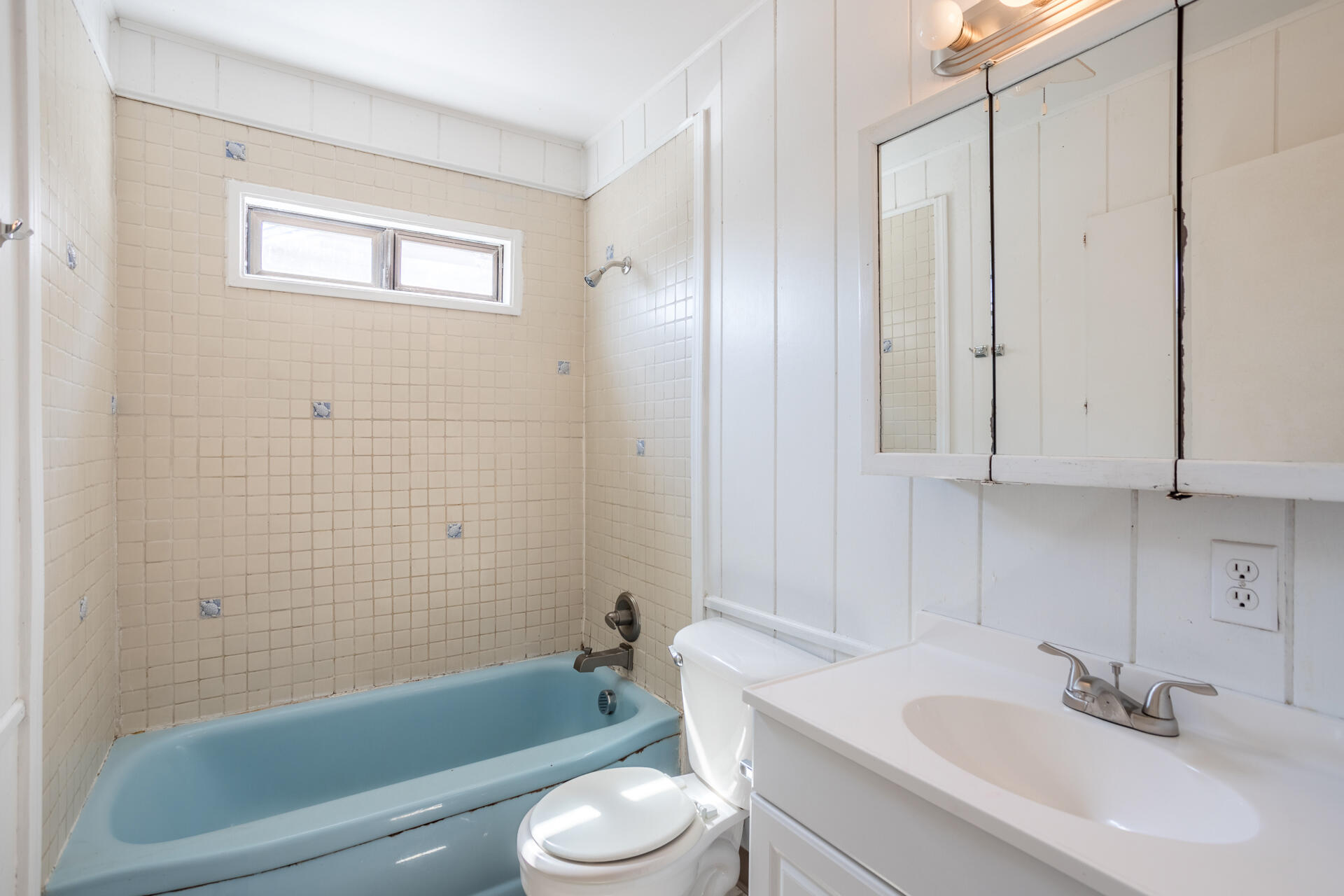 1105 5th Street Redding, CA 96002 - Photo 10 of 11 a bathroom with a sink a toilet and shower