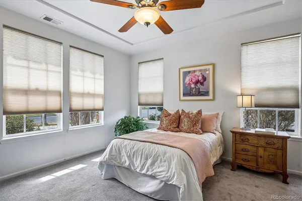 a bedroom with a bed dresser and a window