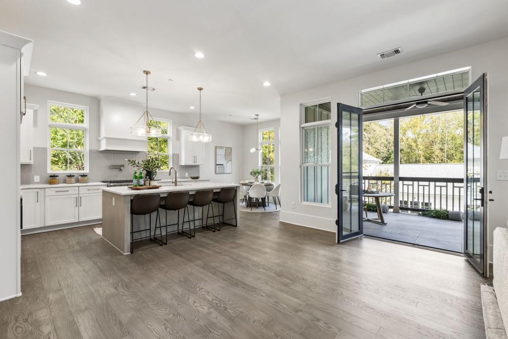 12455 Broadwell Road, Unit 201 Milton, GA 30004 - Photo 18 of 38 a large living room with a large window