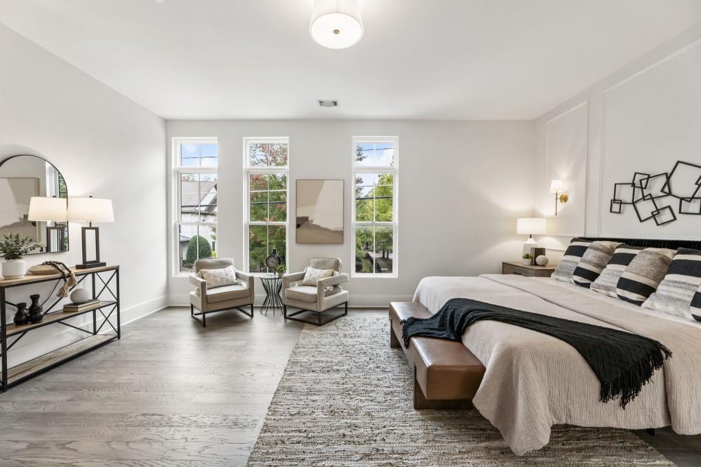 12455 Broadwell Road, Unit 201 Milton, GA 30004 - Photo 28 of 38 a bedroom with a bed couch and a window