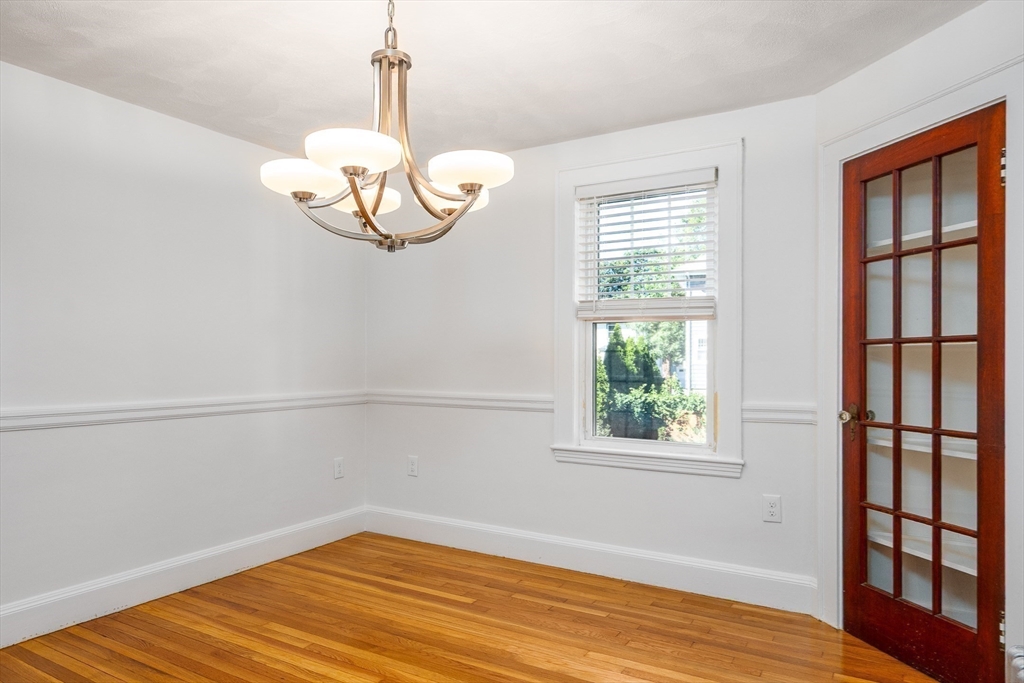 10 Weston Street Milton, MA 02186 - Photo 11 of 35 a view of empty room with wooden floor and fan