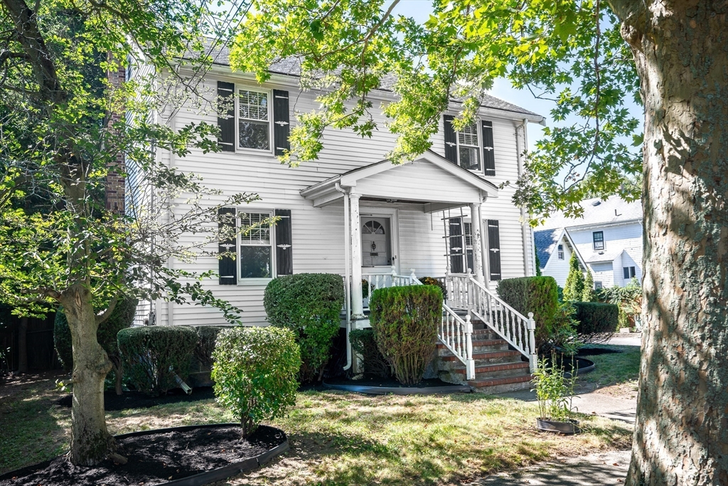 10 Weston Street Milton, MA 02186 - Photo 2 of 35 a front view of a house with garden