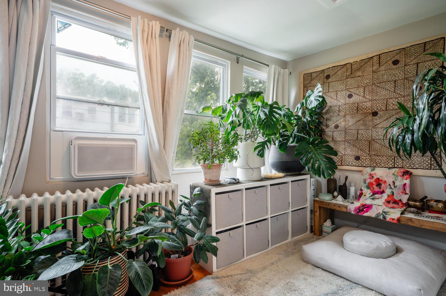1220 Orren Street Northeast Washington, DC 20002 - Photo 22 of 37 Lush greenery brightens a cozy corner retreat.