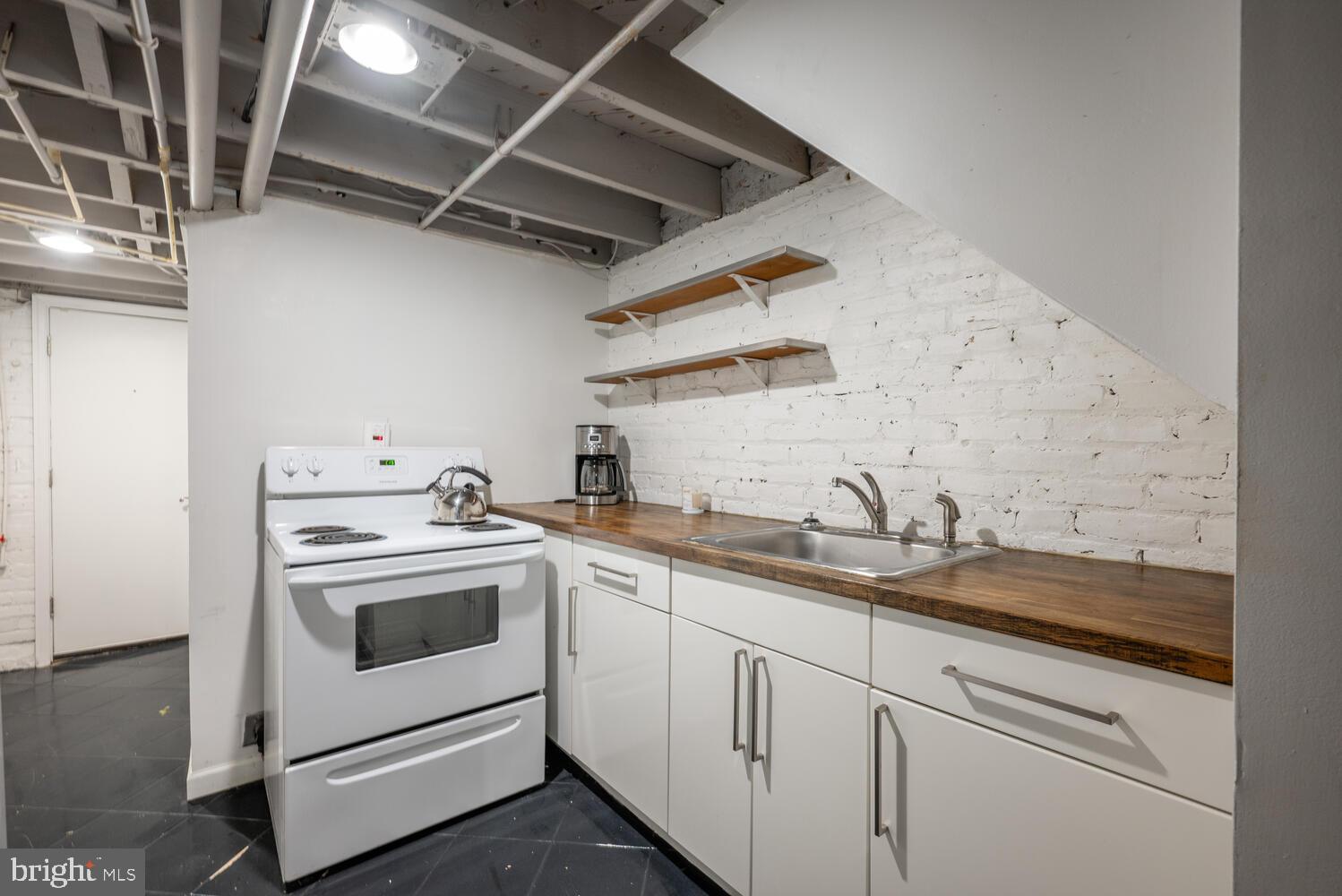 1220 Orren Street Northeast Washington, DC 20002 - Photo 30 of 37 Charming basement kitchen with modern touches.