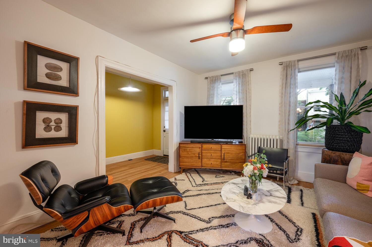 1220 Orren Street Northeast Washington, DC 20002 - Photo 6 of 37 Chic living space with vibrant accents.