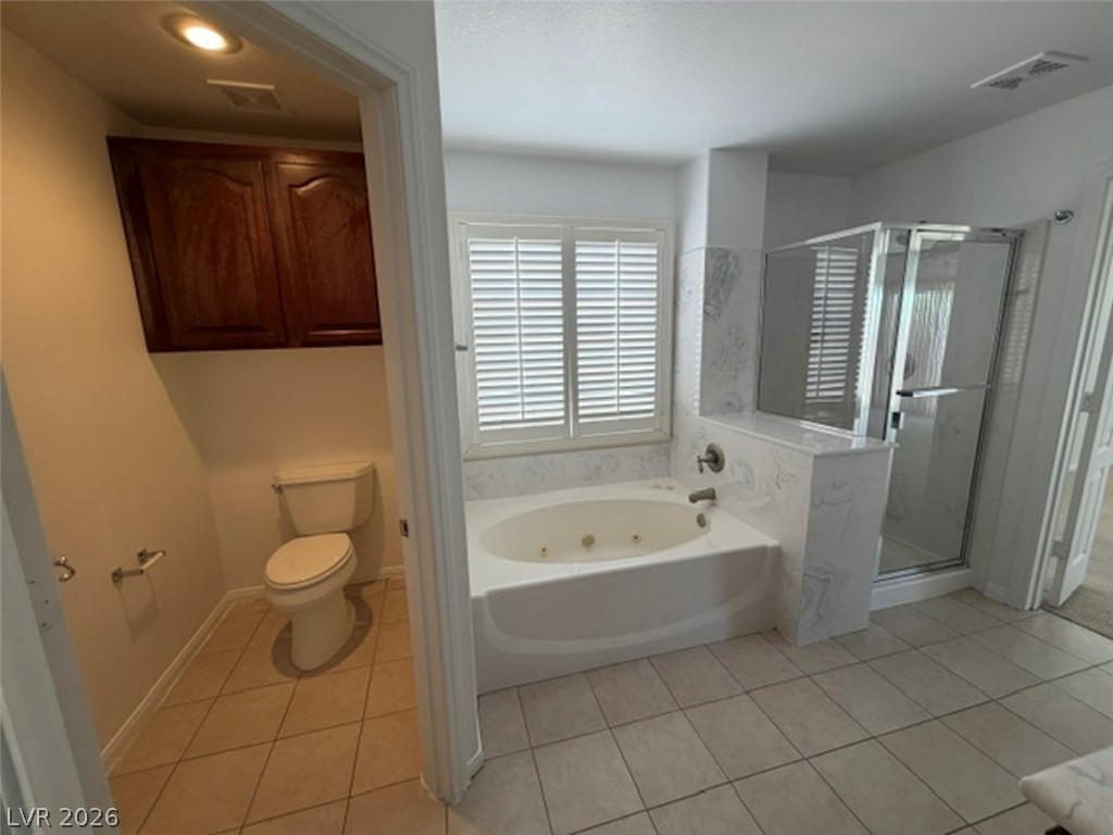 3862 Landing Ridge Place Las Vegas, NV 89135 - Photo 14 of 26 Indulge in relaxation with this primary bathroom's jetted tub and separate glass-enclosed shower.
