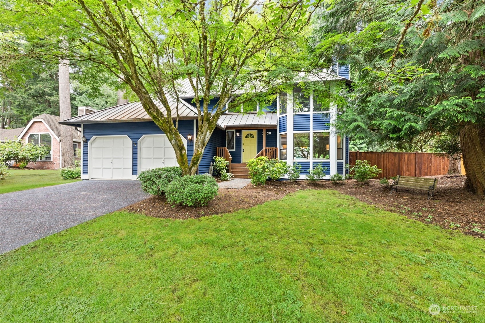 2330 243rd Place Southeast Bothell, WA 98021 - Photo 1 of 40 a front view of a house with yard and green space