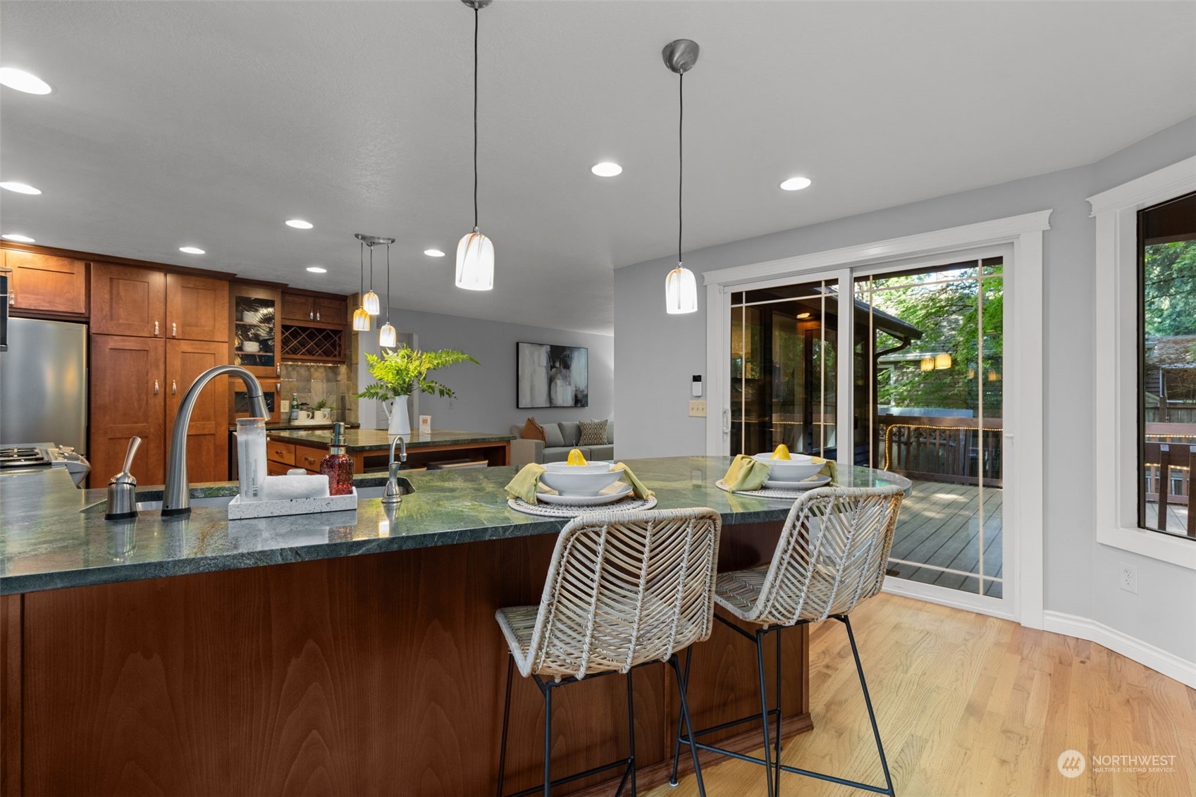 2330 243rd Place Southeast Bothell, WA 98021 - Photo 12 of 40 a kitchen with a table chairs stove and wooden floor